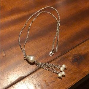 Faux pearl and silver tone statement necklace.
